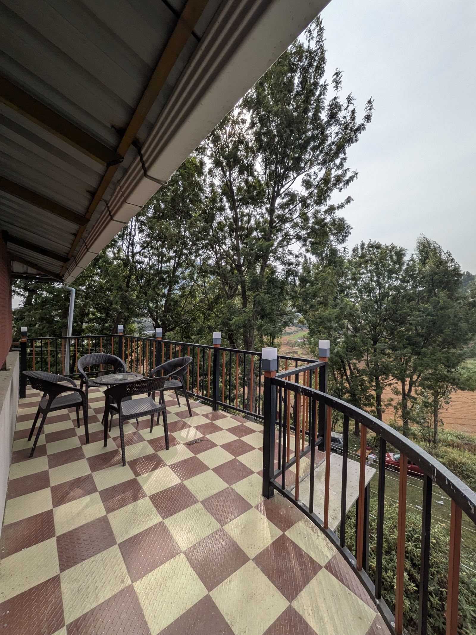 Balcony seating area with checkerboard tile floor